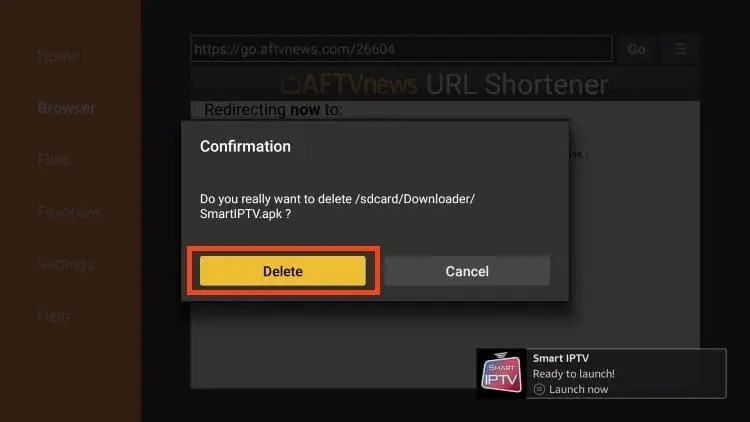 This image shows the confirmation screen for deleting the Smart IPTV installation file (APK) after successful installation on a FireStick device using the Downloader app. Description: A dark confirmation dialog box is displayed in the center of the screen. The message reads: "Do you really want to delete /sdcard/Downloader/SmartIPTV.apk?" Below the message, two options are presented: "Delete" (highlighted in yellow) – confirms the removal of the APK file to free up space. "Cancel" – aborts the deletion and keeps the APK file on the device. In the bottom-right corner, there's a notification saying: "Smart IPTV – Ready to launch! Launch now", indicating the app is already installed and ready to use.